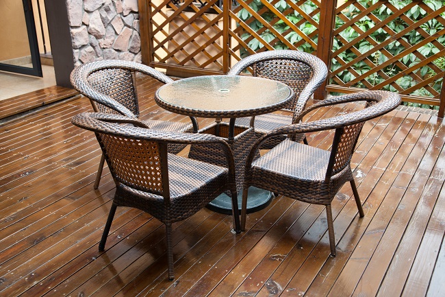 Wicker Chairs And Table On Hardwood Front Deck Vera Roofing 